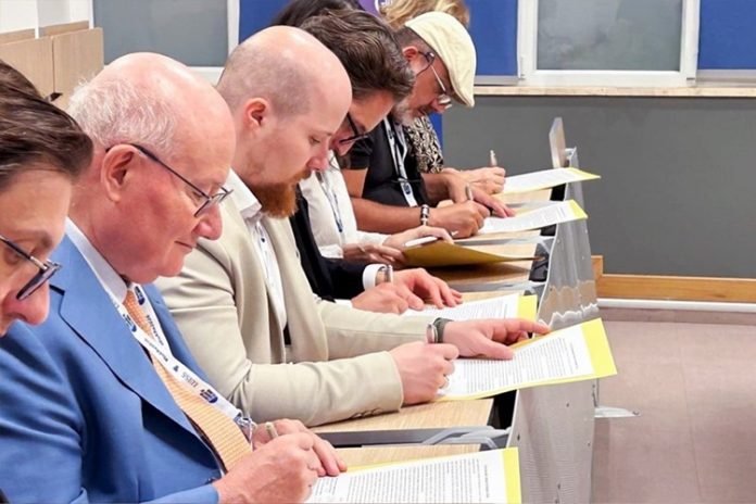Religious-scholars-signing-an-appeal-requesting-an-end-to-Chairman-Lees-detention-696x464-1.jpg